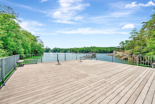 wooden deck with a water view