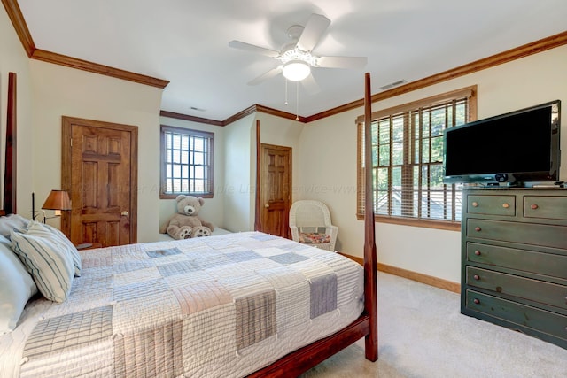 carpeted bedroom with crown molding and ceiling fan