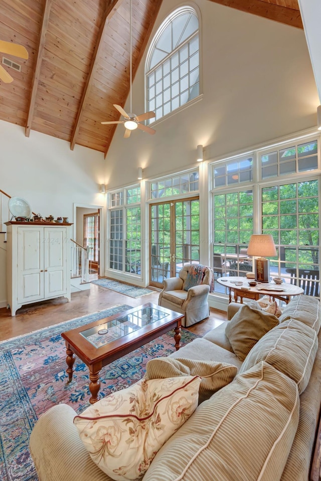 living room with wood ceiling, ceiling fan, beam ceiling, high vaulted ceiling, and wood-type flooring