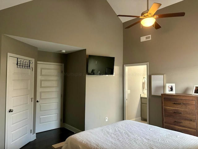 bedroom with ensuite bathroom, ceiling fan, high vaulted ceiling, dark hardwood / wood-style floors, and a closet