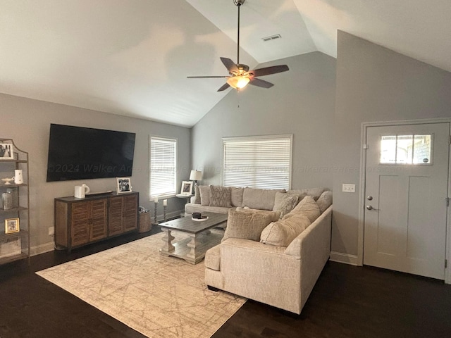 living room with high vaulted ceiling, a wealth of natural light, dark wood-type flooring, and ceiling fan