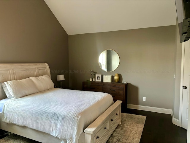 bedroom with lofted ceiling