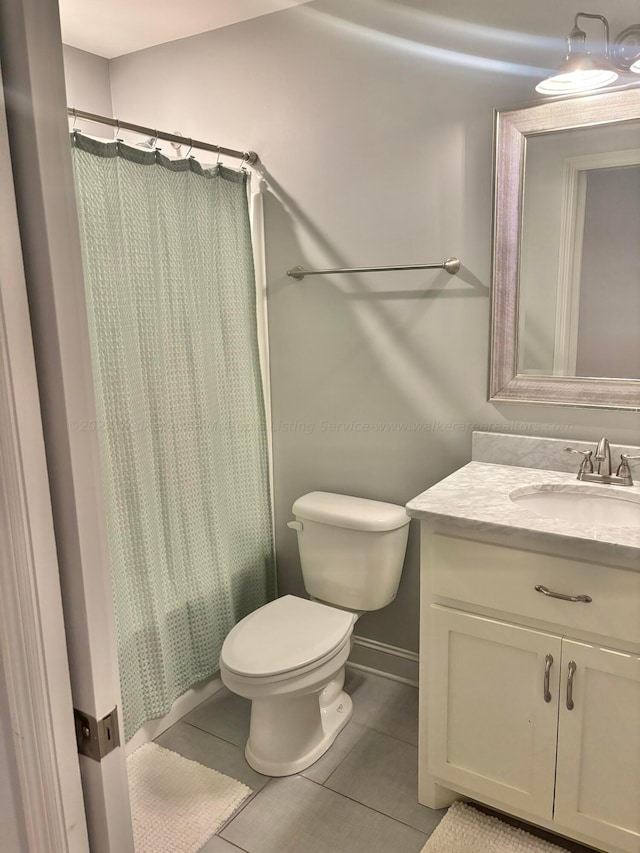 full bathroom with toilet, vanity, tile patterned floors, and shower / bathtub combination with curtain