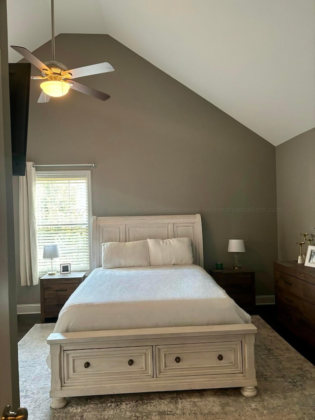 bedroom with ceiling fan and high vaulted ceiling