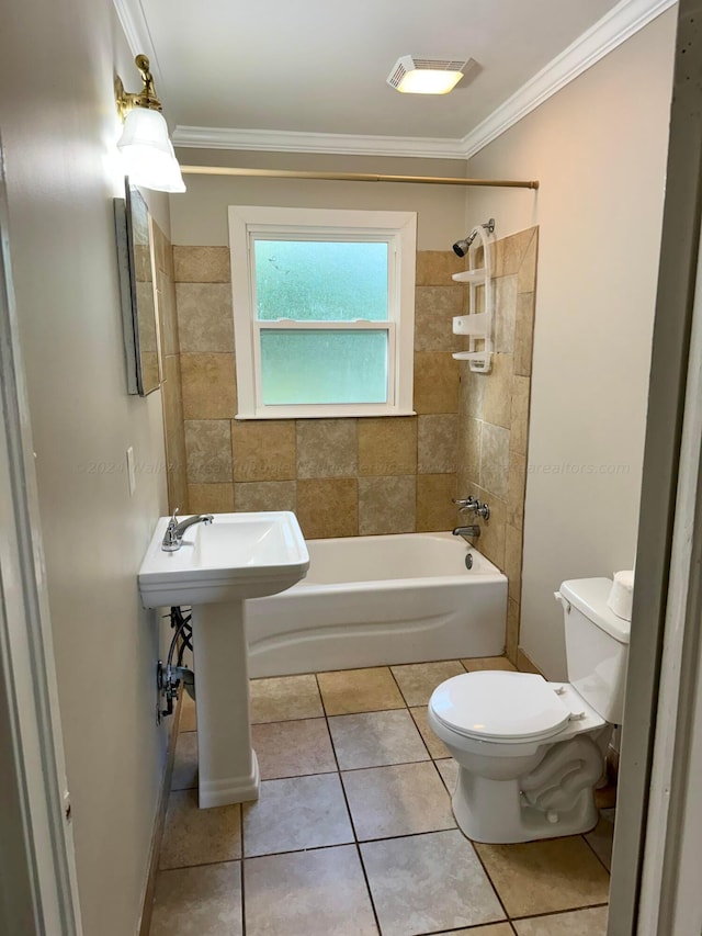 full bathroom featuring tile patterned floors, sink, tiled shower / bath, toilet, and ornamental molding