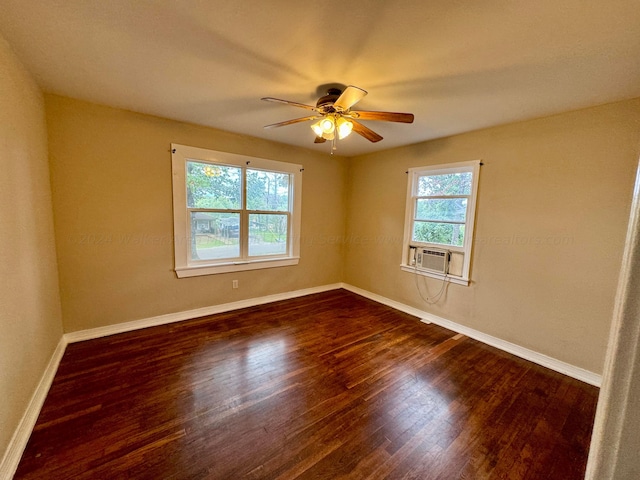 unfurnished room with ceiling fan, cooling unit, and dark wood-type flooring