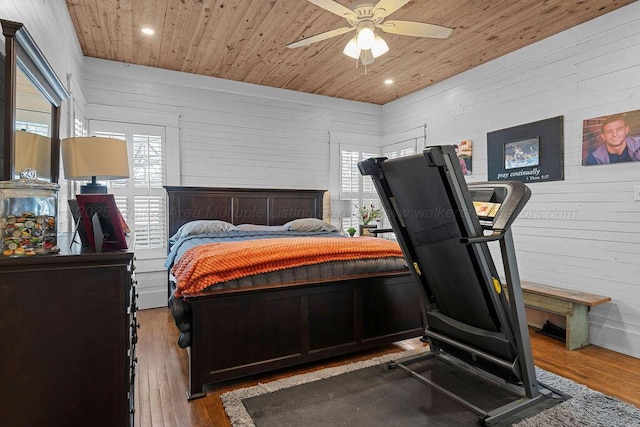 bedroom featuring hardwood / wood-style floors, wooden ceiling, and recessed lighting