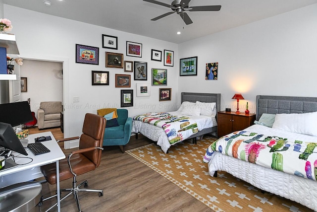 bedroom with dark hardwood / wood-style floors and ceiling fan