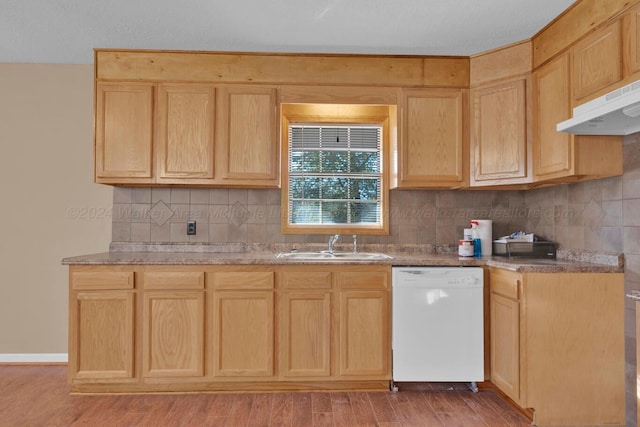 kitchen with light brown cabinetry, white dishwasher, and light hardwood / wood-style floors