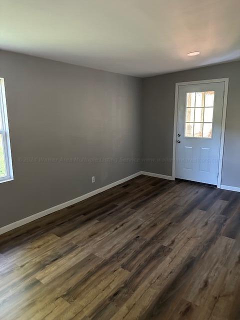 interior space with dark wood-type flooring