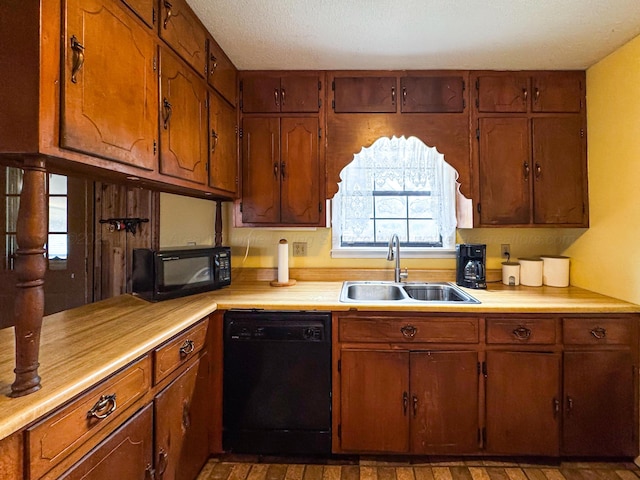 kitchen featuring sink and black appliances