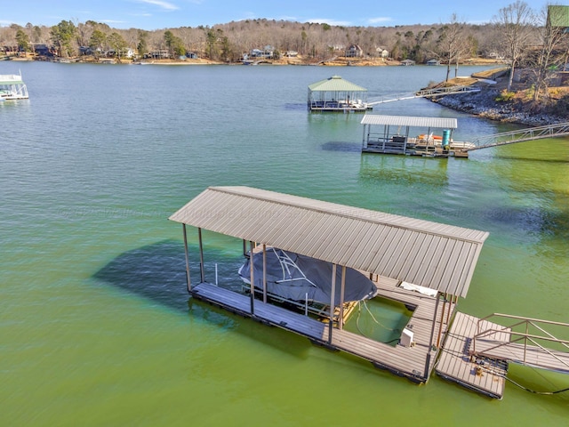 dock area featuring a water view and boat lift