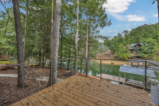 deck with a water view and a dock