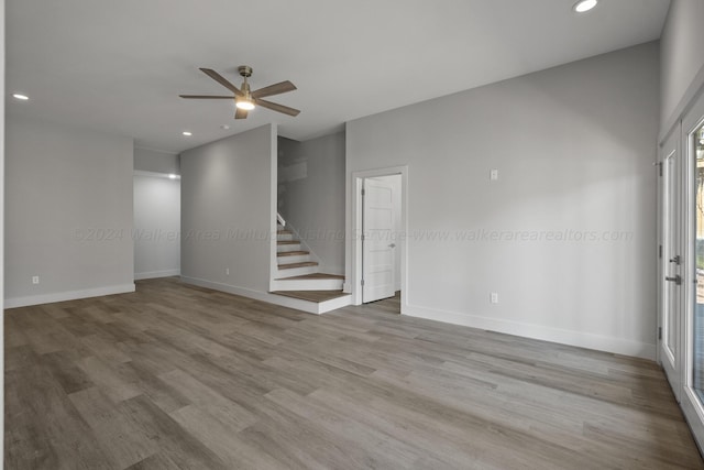 spare room featuring ceiling fan and light wood-type flooring