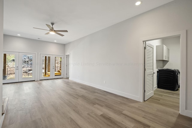 unfurnished living room featuring ceiling fan, light hardwood / wood-style floors, and french doors