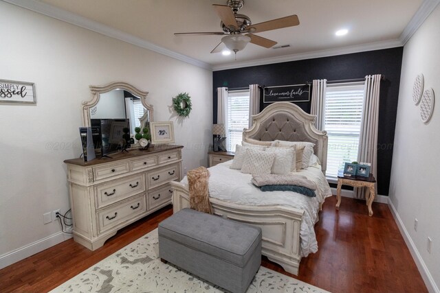 bedroom featuring hardwood / wood-style floors, ceiling fan, ornamental molding, and multiple windows