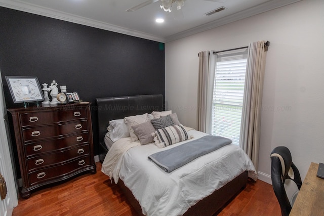 bedroom with wood-type flooring, ceiling fan, and crown molding