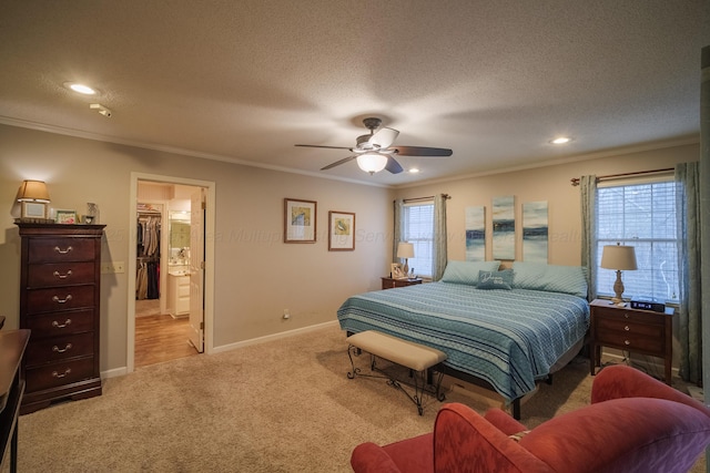 bedroom with crown molding, light carpet, and a textured ceiling