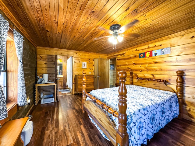 bedroom with dark hardwood / wood-style flooring