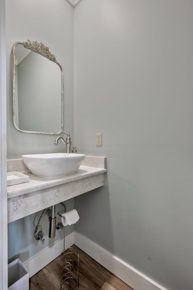 bathroom with sink and hardwood / wood-style floors