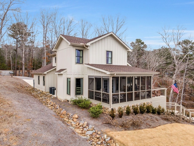 view of property exterior with a sunroom