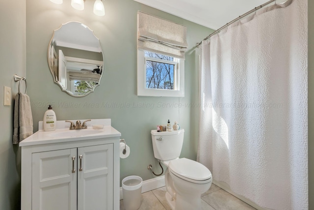 bathroom with vanity, tile patterned floors, toilet, and walk in shower