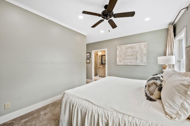 carpeted bedroom featuring ceiling fan and ensuite bathroom