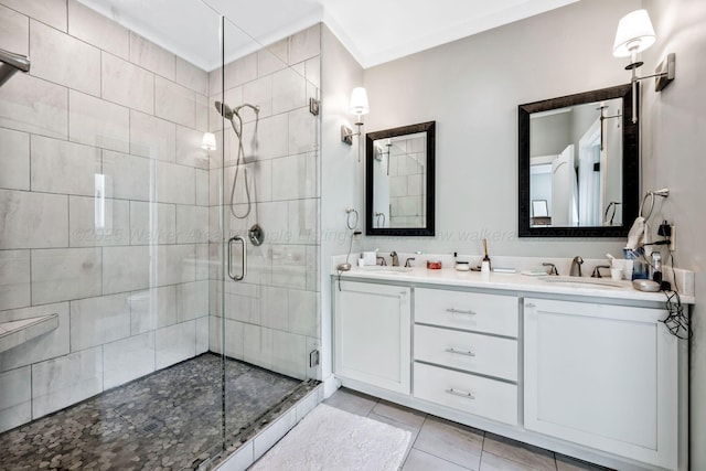 bathroom featuring vanity, tile patterned floors, and a shower with shower door