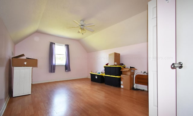 bonus room with hardwood / wood-style flooring, ceiling fan, and vaulted ceiling