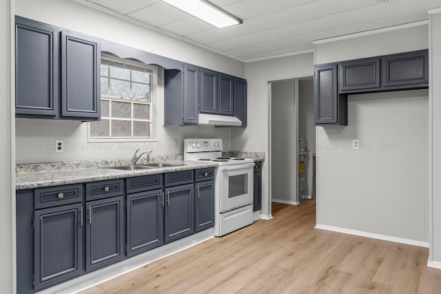 kitchen featuring electric range, sink, and light hardwood / wood-style floors