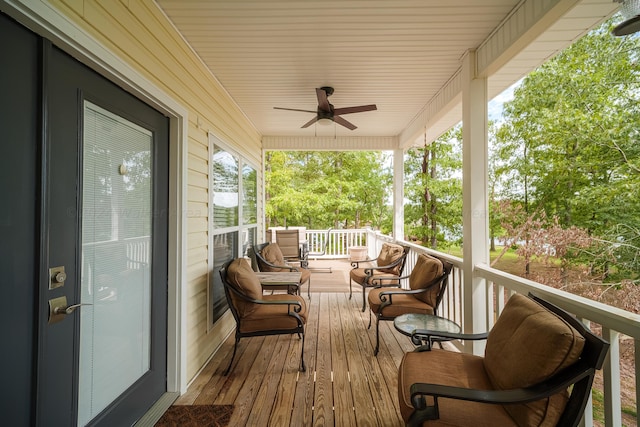 wooden terrace with ceiling fan and a porch