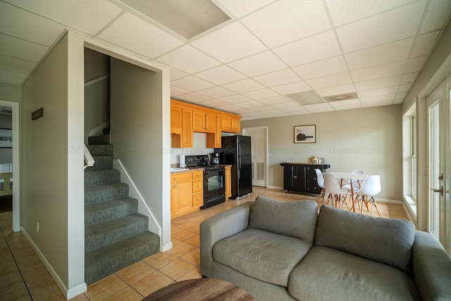 tiled living room with a drop ceiling