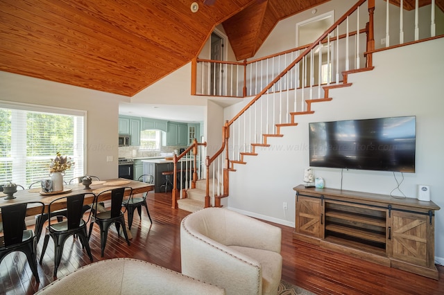 dining area featuring dark hardwood / wood-style flooring, high vaulted ceiling, and wood ceiling