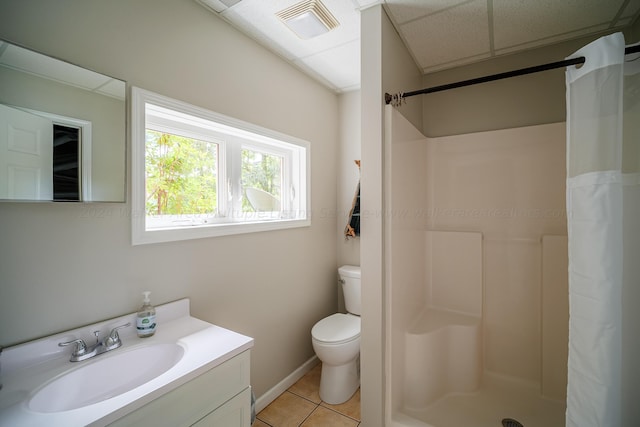 bathroom with toilet, tile patterned flooring, vanity, and a shower with shower curtain