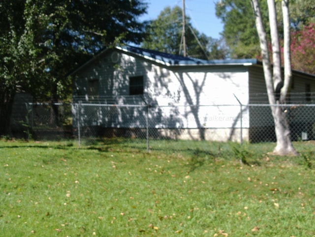 view of property exterior with a lawn