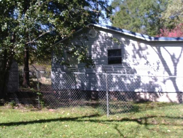 view of home's exterior featuring a yard