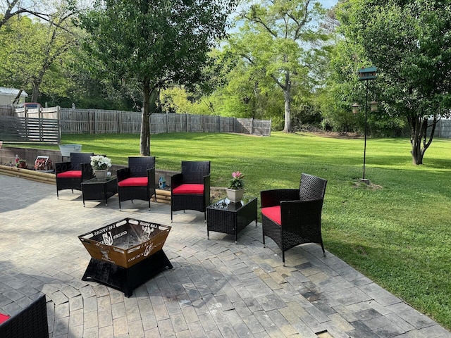 view of patio / terrace with an outdoor living space with a fire pit