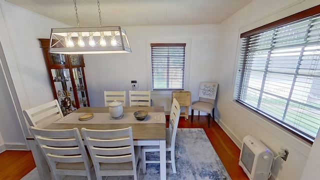 dining room with dark wood-type flooring