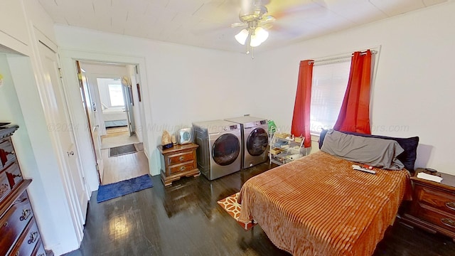 bedroom with washer and dryer, ceiling fan, and dark wood-type flooring