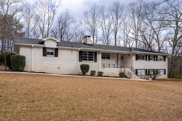 view of front of house with a porch and a front yard