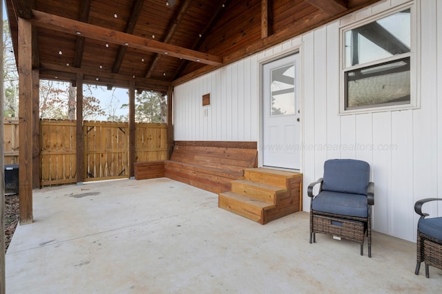 view of patio featuring entry steps and fence