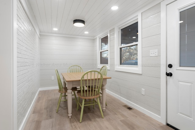 dining room featuring recessed lighting, visible vents, wood ceiling, brick wall, and light wood-type flooring