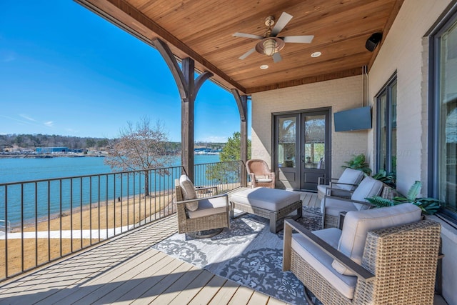 wooden terrace featuring a ceiling fan and an outdoor hangout area