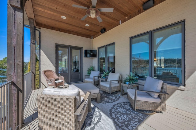 deck featuring an outdoor hangout area and a ceiling fan