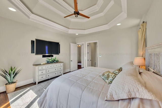 bedroom featuring ornamental molding, recessed lighting, a raised ceiling, and baseboards