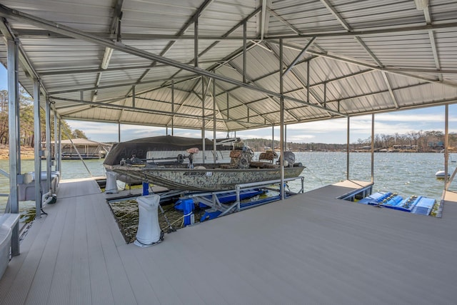 dock area with a water view and boat lift