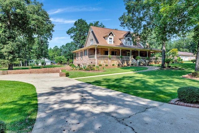 view of front facade with a porch and a front lawn