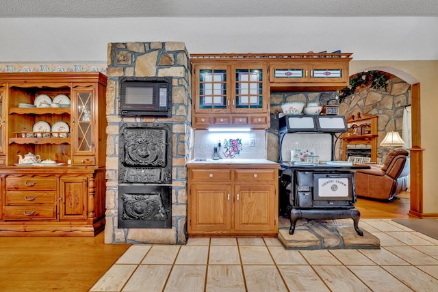 kitchen featuring light hardwood / wood-style flooring and a textured ceiling