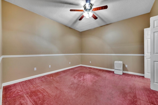 unfurnished room featuring ceiling fan, a textured ceiling, and carpet flooring