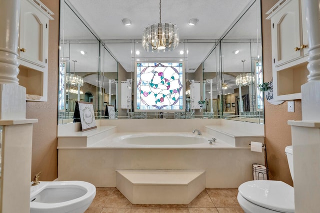 bathroom featuring toilet, an inviting chandelier, a bidet, a bath, and tile patterned flooring